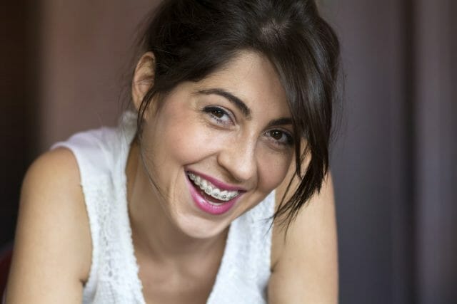 Woman with braces smiling